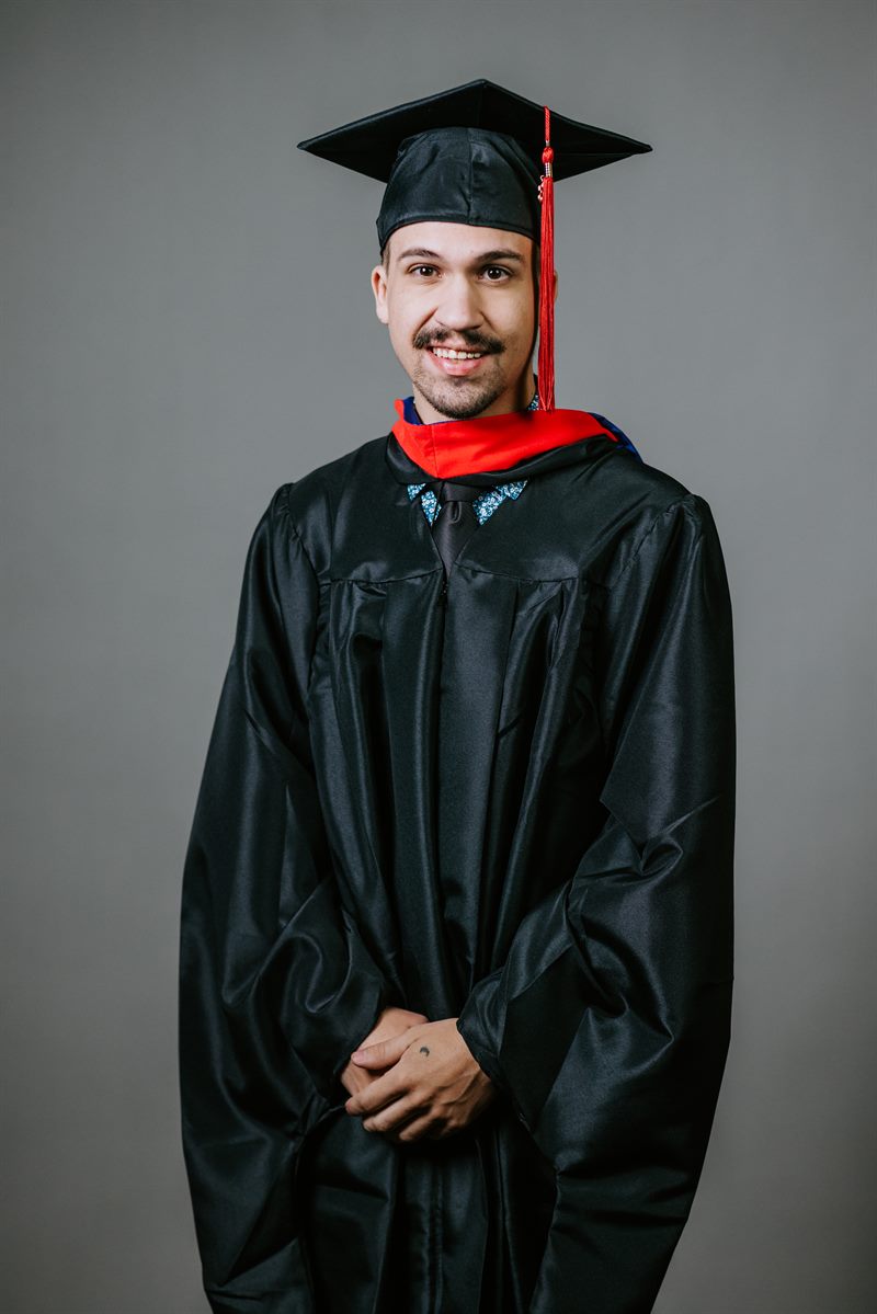 Logan Lancour in graduation regalia after completing the MBTS Accelerate Program, May 2026.
